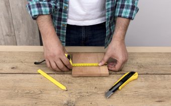 carpenter-man-using-ruler-cutter